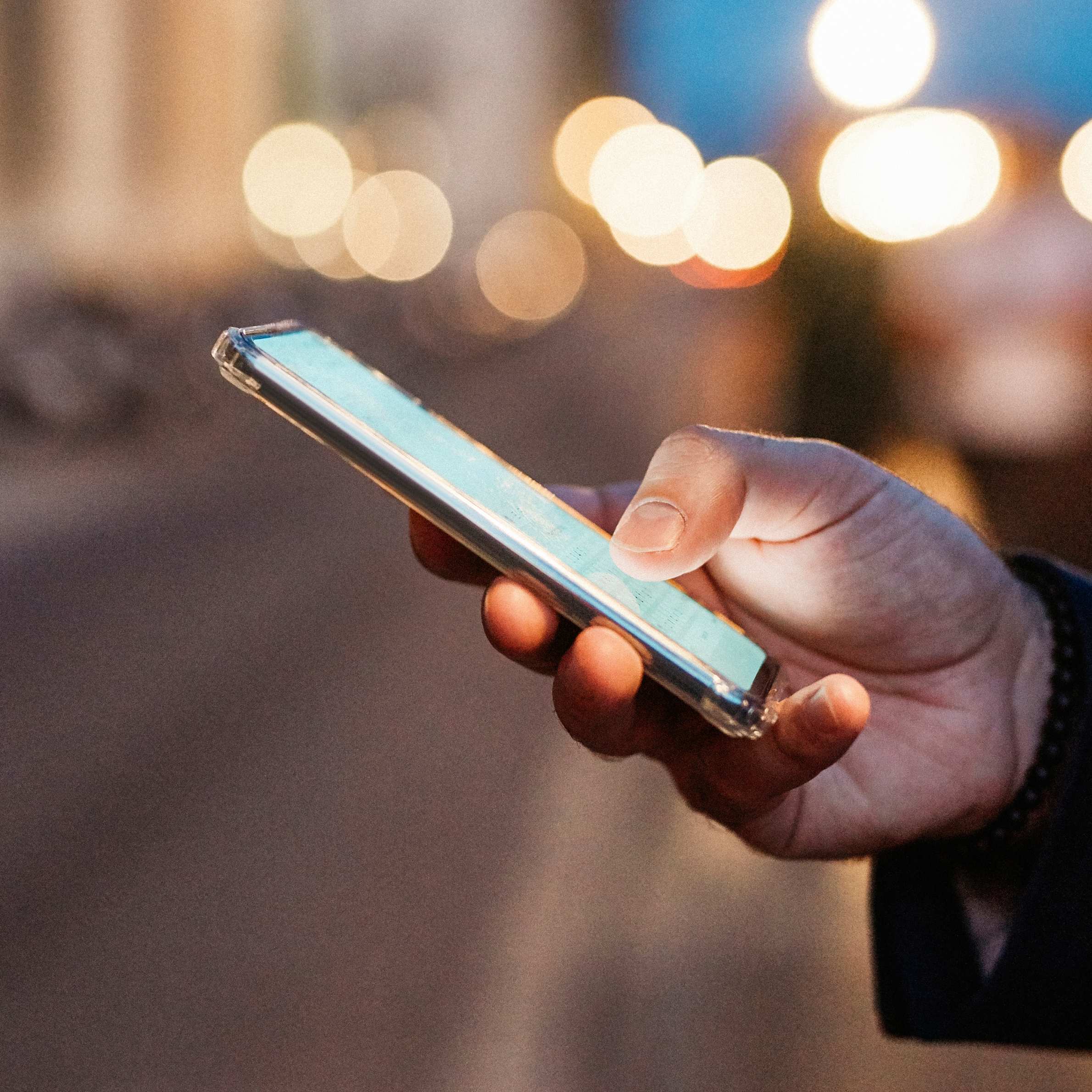 Person using smartphone for AI search