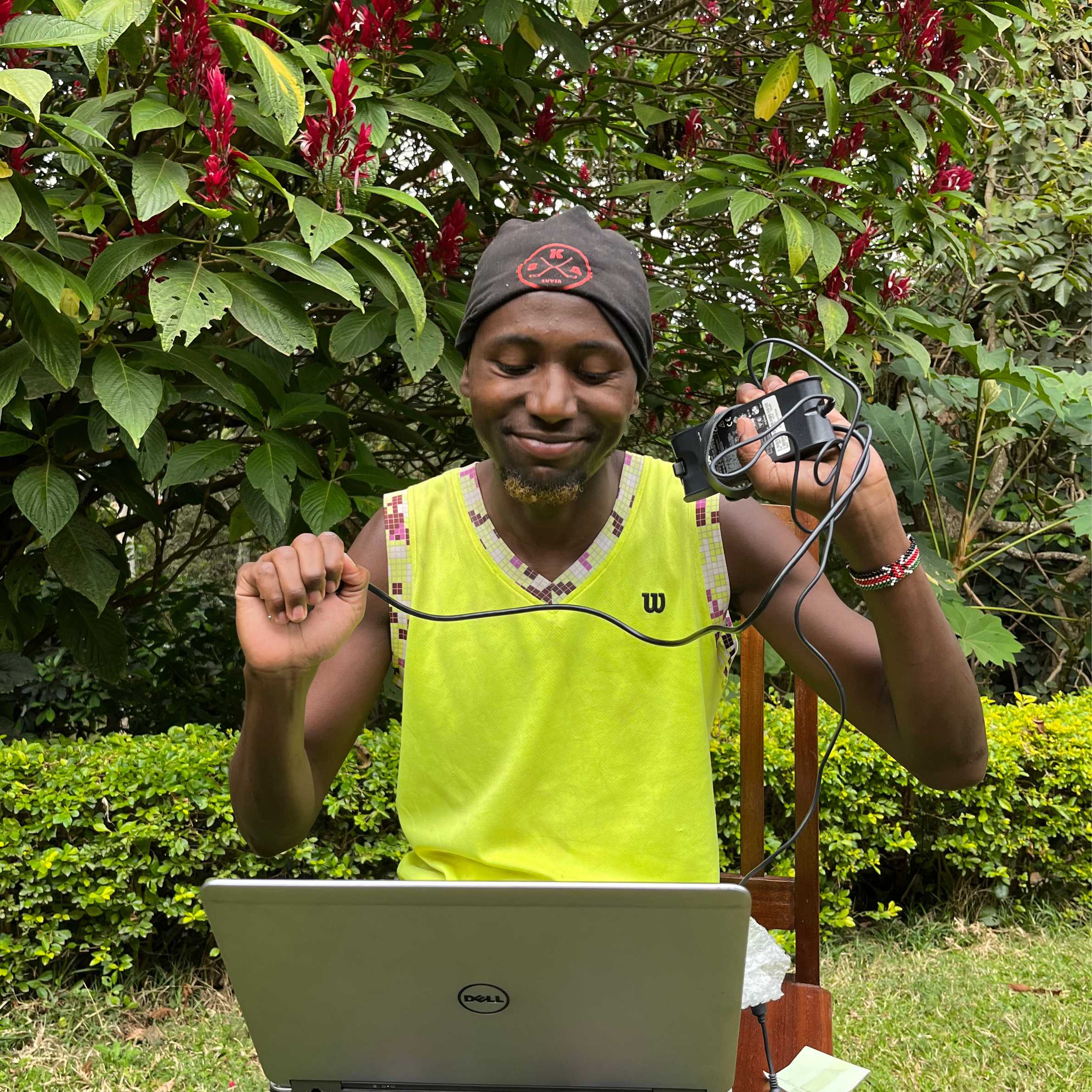 Refugee developer celebrating successful work